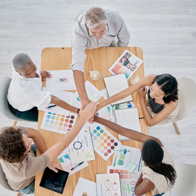 Team work, hands or creative business people in a meeting planning a logo, branding or marketing co